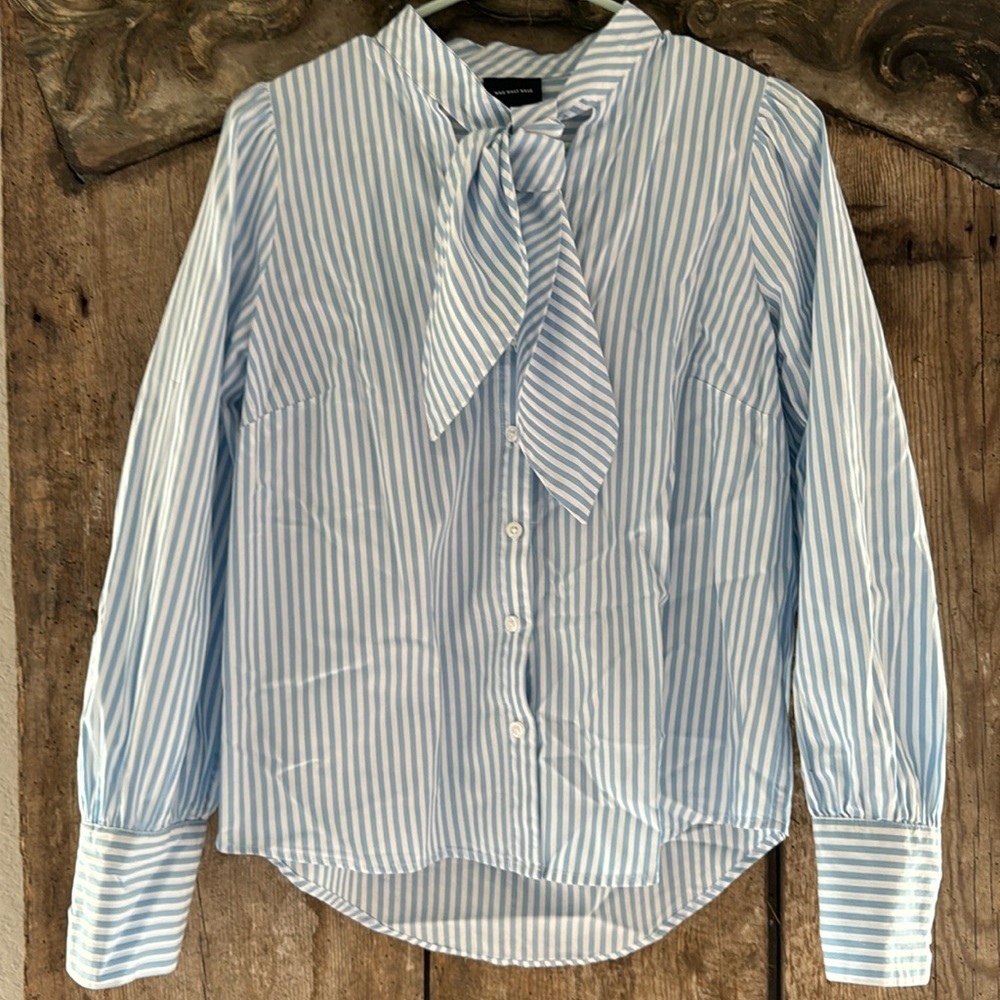 Who What Wear white and blue striped blouse with tie around neck.